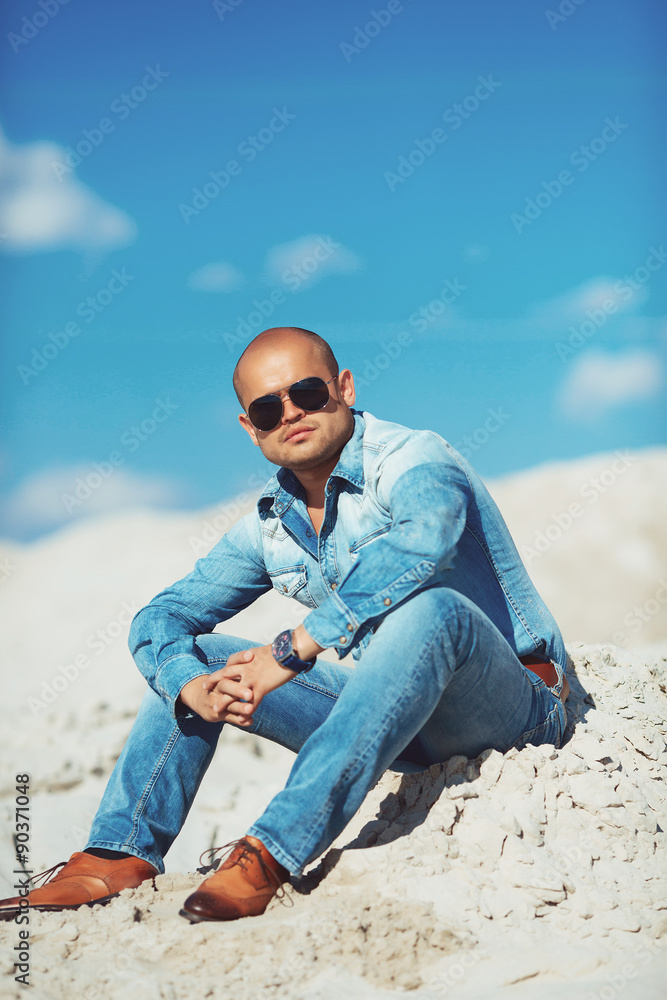 Young Attractive Man Relaxing at the Beach