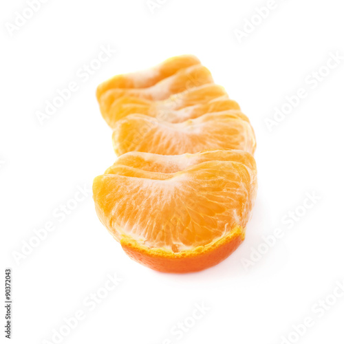 Line of fresh juicy tangerine fruit isolated over the white