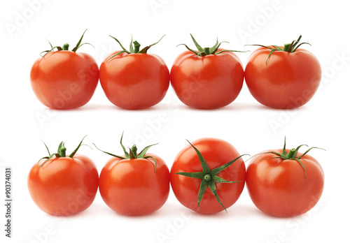 Four tomatoes in a line isolated
