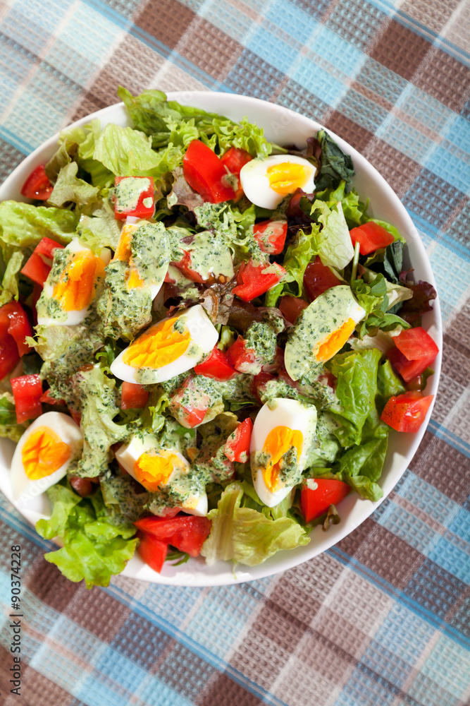 Summer salad with tomatos and boiled eggs Summer salad with tomatos and boiled eggs