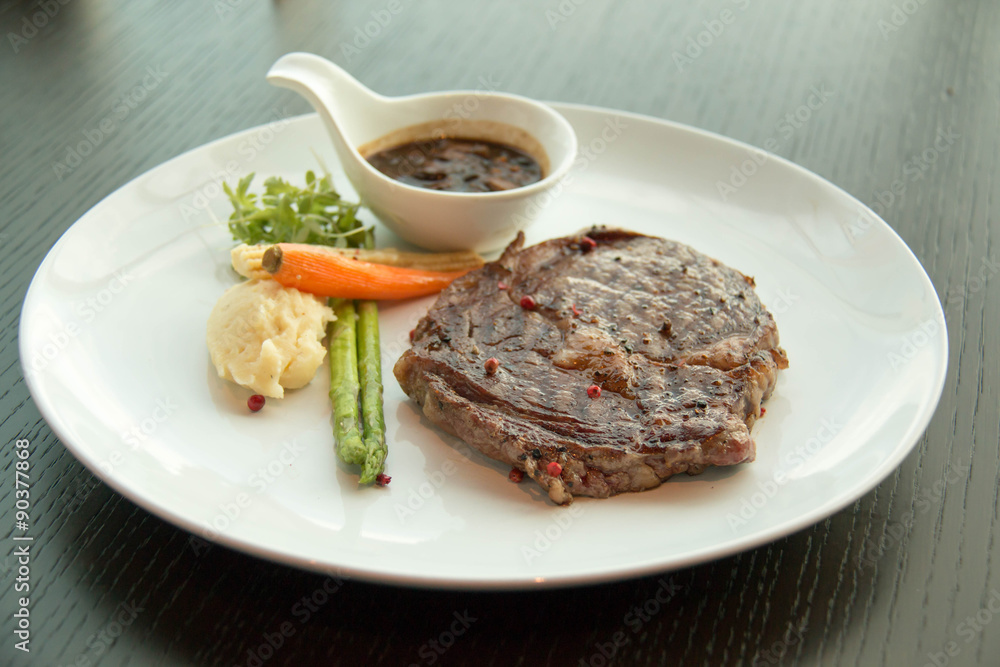 sirloin steak, served with asparagus, grilled carrot sirloin steak, served with asparagus, grilled carrot