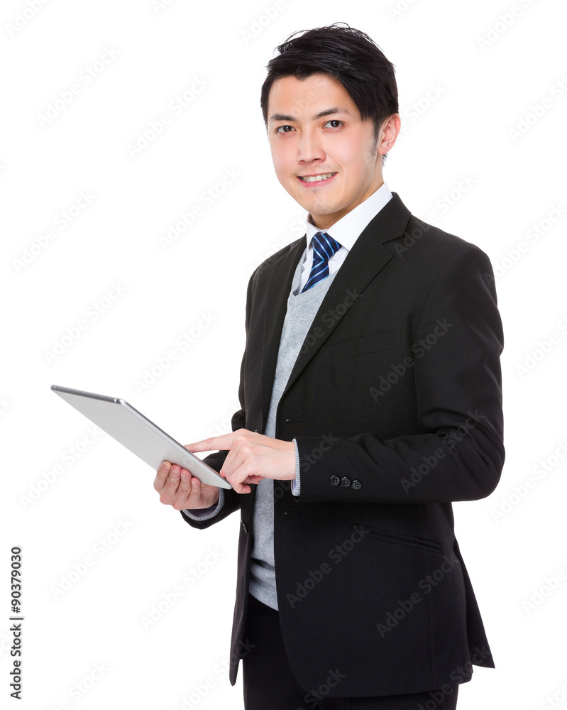 Asian young businessman use of the tablet pc