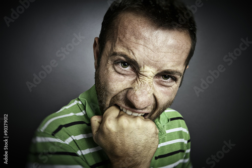 Closeup portrait of an angry guy