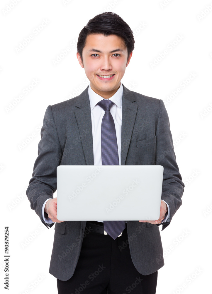 Asian businessman use of the notebook computer Asian businessman use of the notebook computer