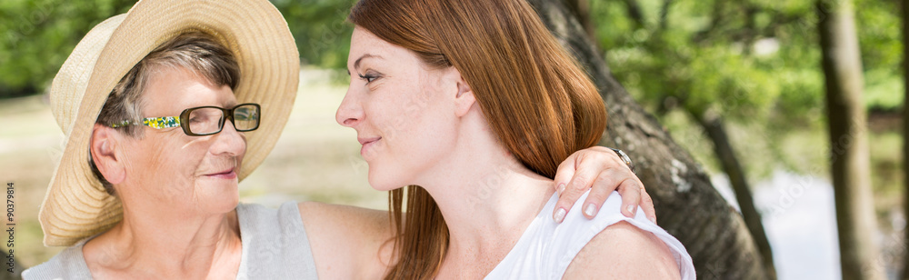 Naklejka premium Caring grandma and granddaughter