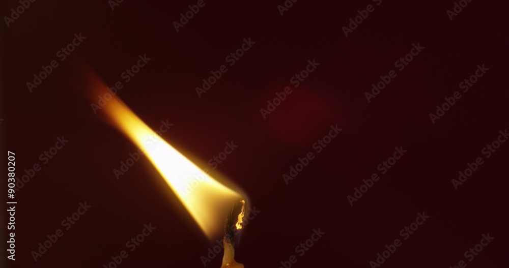 Macro close-up of candle on deep red background Macro close-up of candle on deep red background