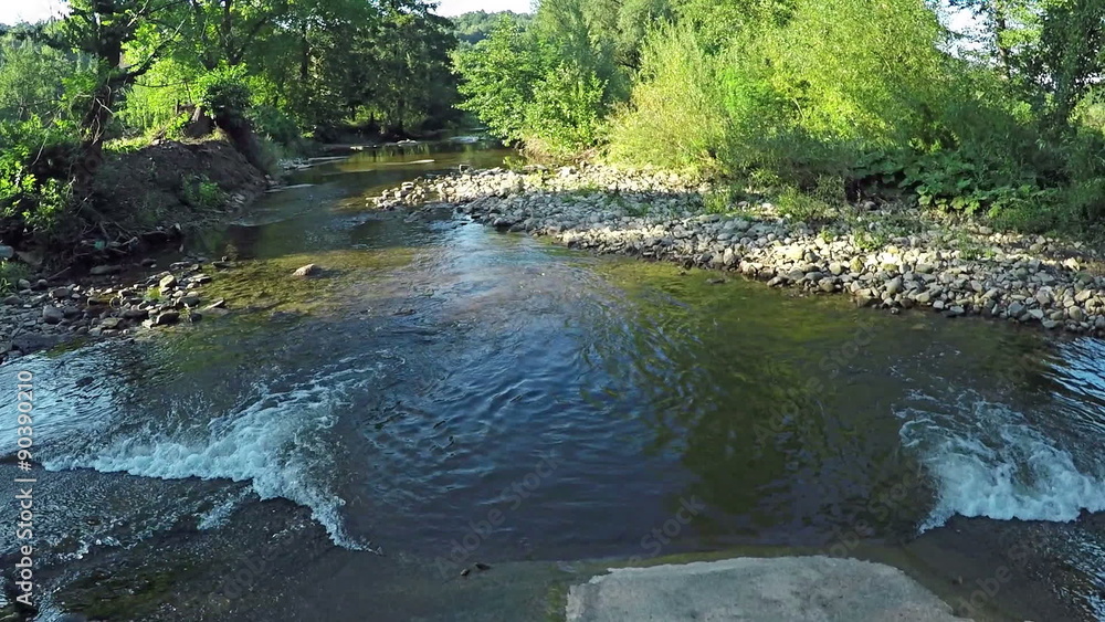 AERIAL: Flying over river in the forest mountain AERIAL: Flying over river in the forest mountain