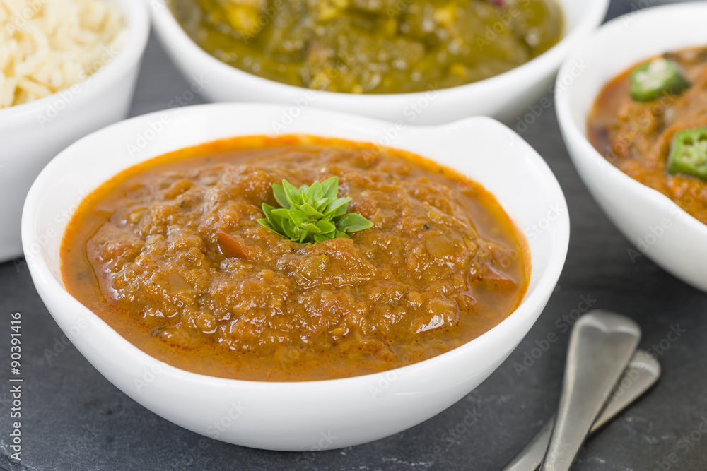 Baigan Bharta - Roasted mashed aubergines cooked with onions, tomatoes and spices. Chapattis and other vegetarian curries on background.
Baigan Bharta - Roasted mashed aubergines cooked with onions, tomatoes and spices. Chapattis and other vegetarian curries on background.