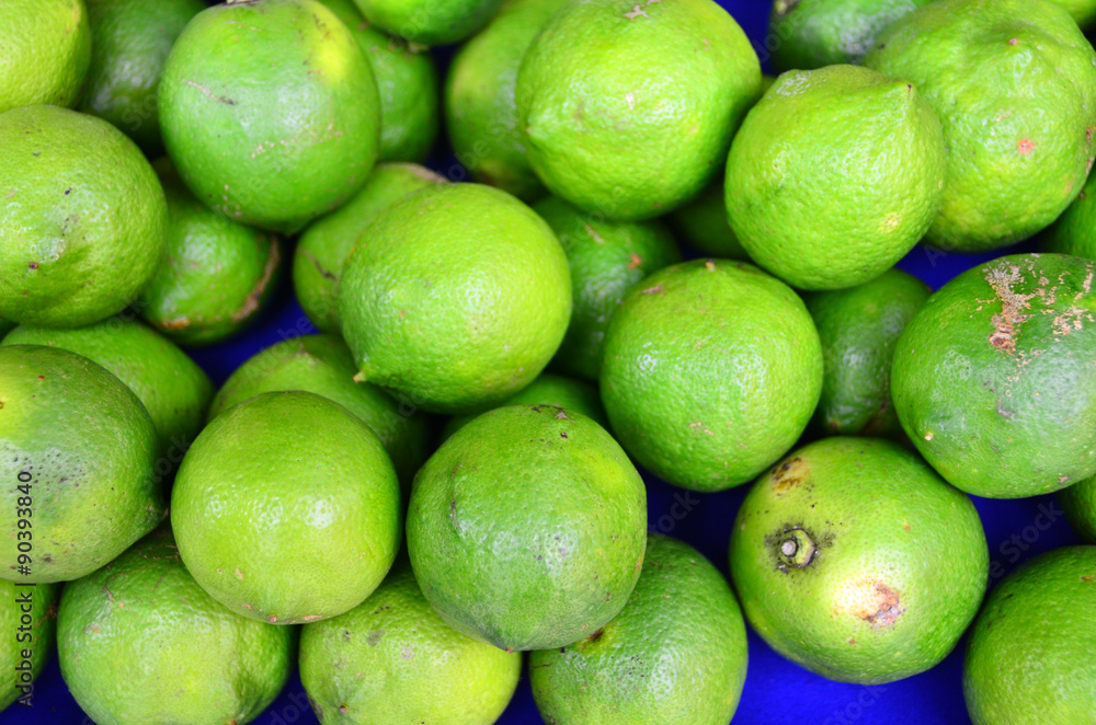 Green colored fruits are on grocery shelf. Green colored fruits are on grocery shelf.