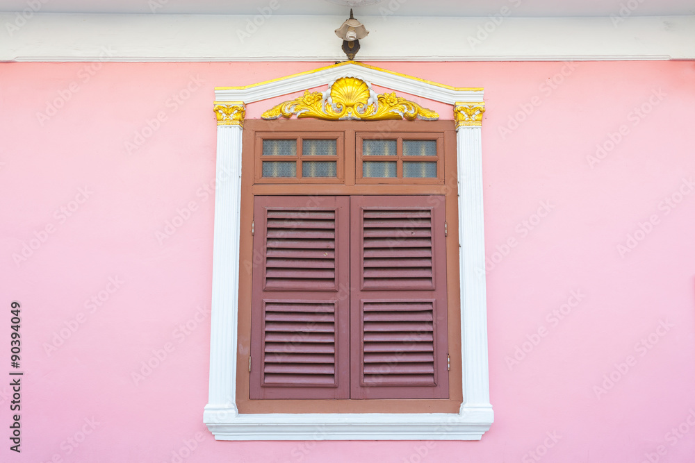 Beautiful window on pink wall in Sino Portuguese style at Soi Ro