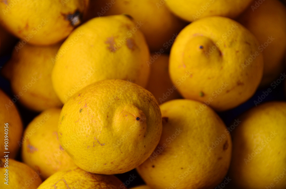 Yellow colored fruits are on grocery shelf. Yellow colored fruits are on grocery shelf.