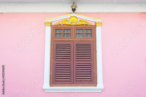 Obraz na płótnie Beautiful window on pink wall in Sino Portuguese style at Soi Ro w salonie