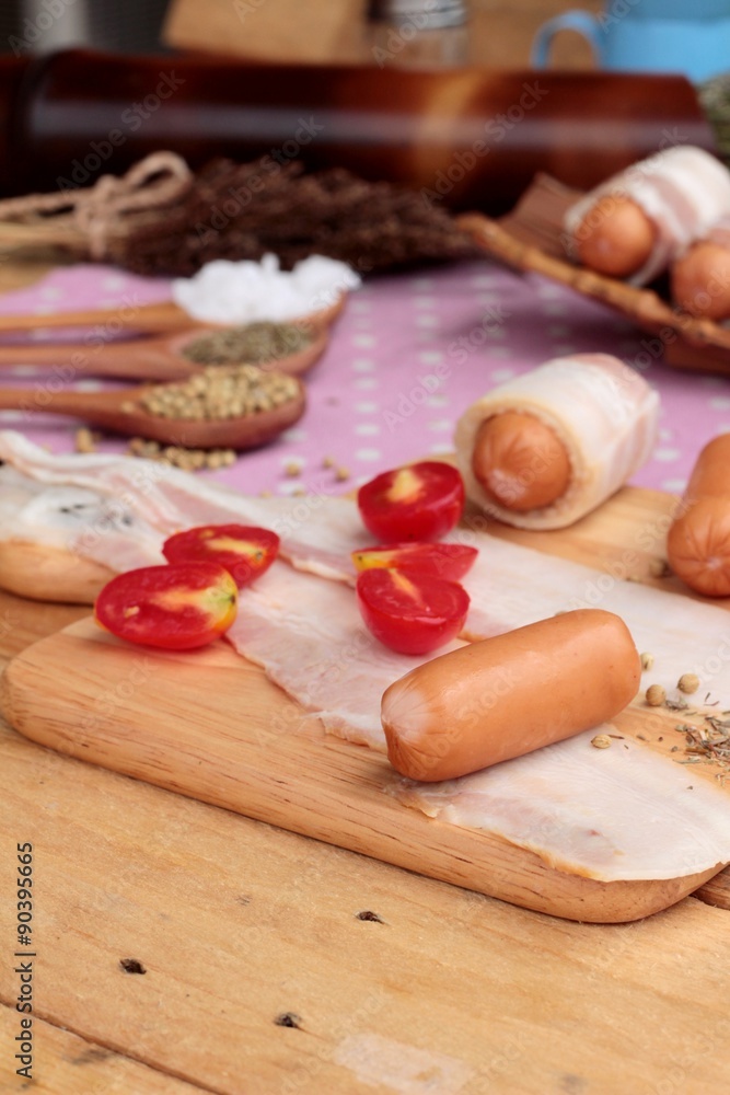 Sausages wrapped in raw bacon fat at delicious. Sausages wrapped in raw bacon fat at delicious.