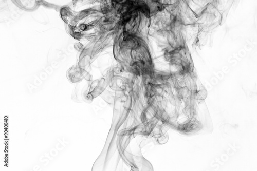 Abstract black smoke swirls over white background