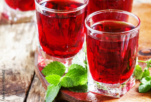 Pomegranate red cocktail with mint, selective focus