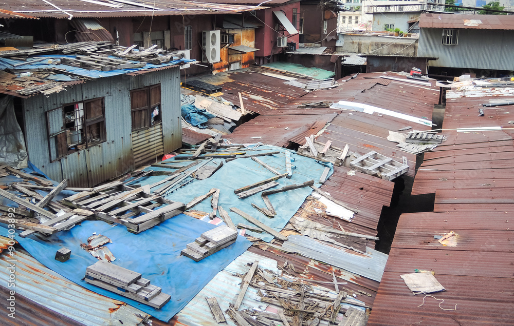 Old dirty rooftop house with messy wood