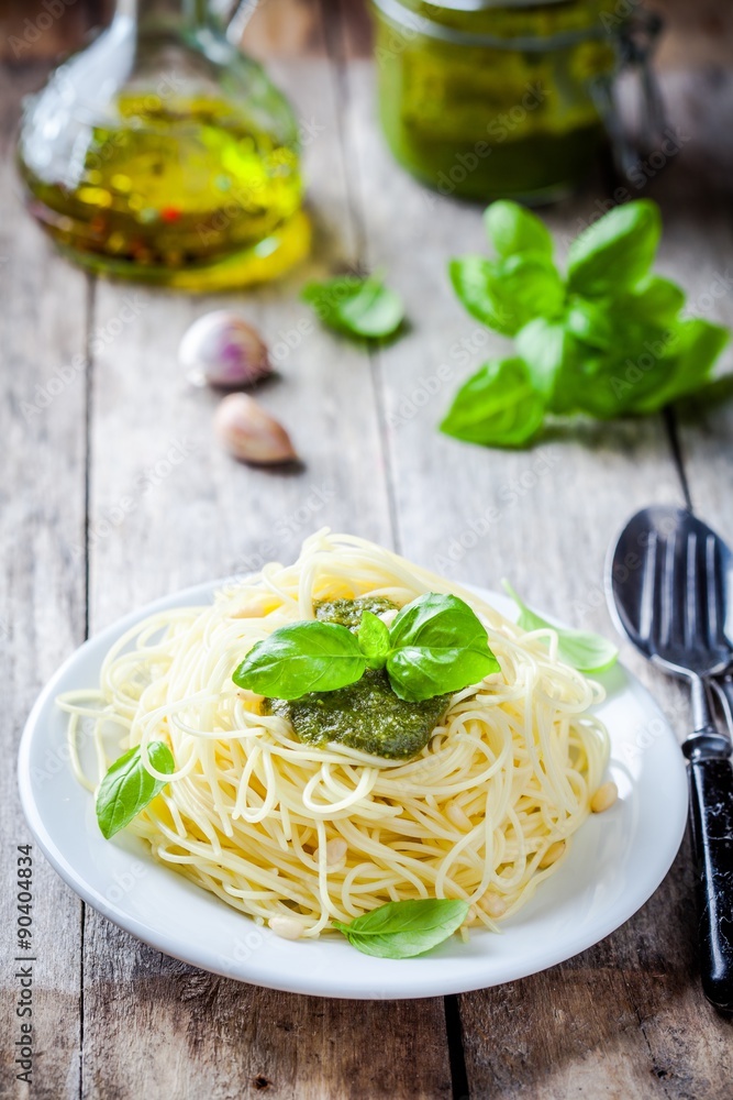 Spaghetti with pesto sauce and basil