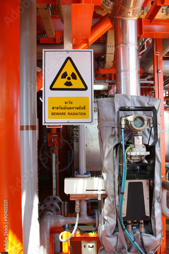 Flow meter, with high radiation sign.