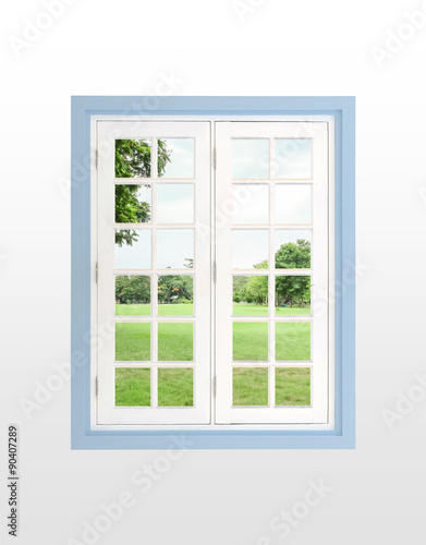 Modern residential window and trees and sky behind