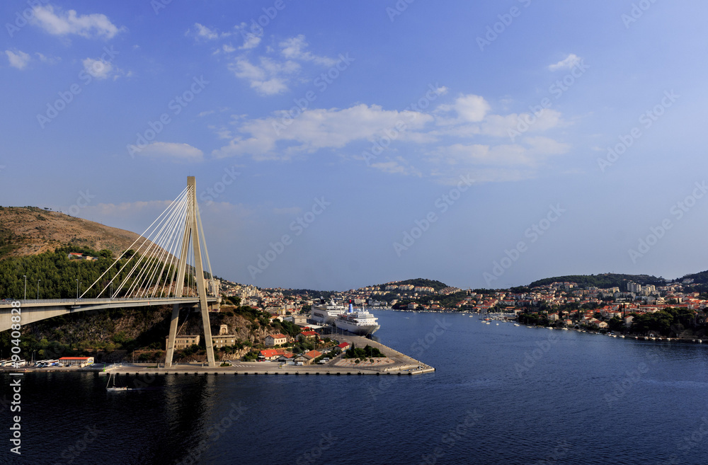 The Franjo Tudman Bridge, and the port of Gruz, with cruiser, passenger ships and other vessels, in Dubrovnik, Croatia