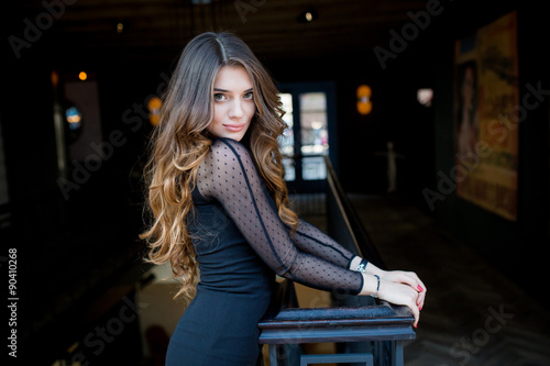 beautiful stylish young woman (girl) in black dress © muzhchil
