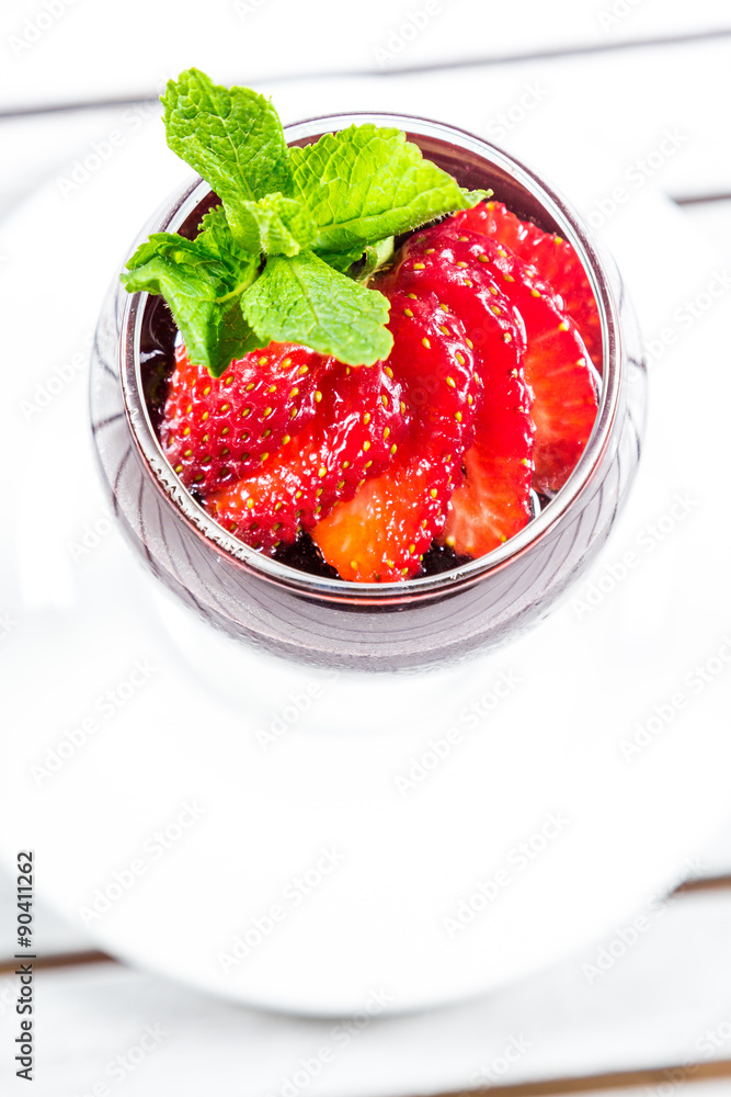 Cocktail with strawberries on a wooden table Cocktail with strawberries on a wooden table