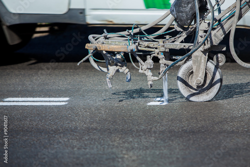 Slika na platnu Teamwork: Pavement Asphalt Road Marking Paint and Striping with