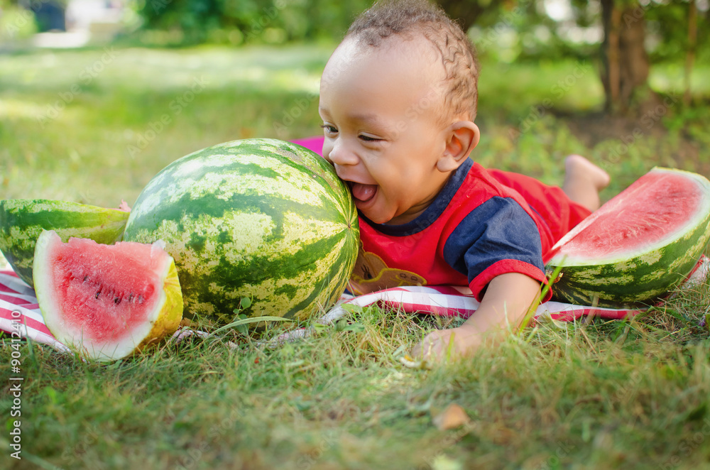 black kid eating watermelon foto de Stock Adobe Stock