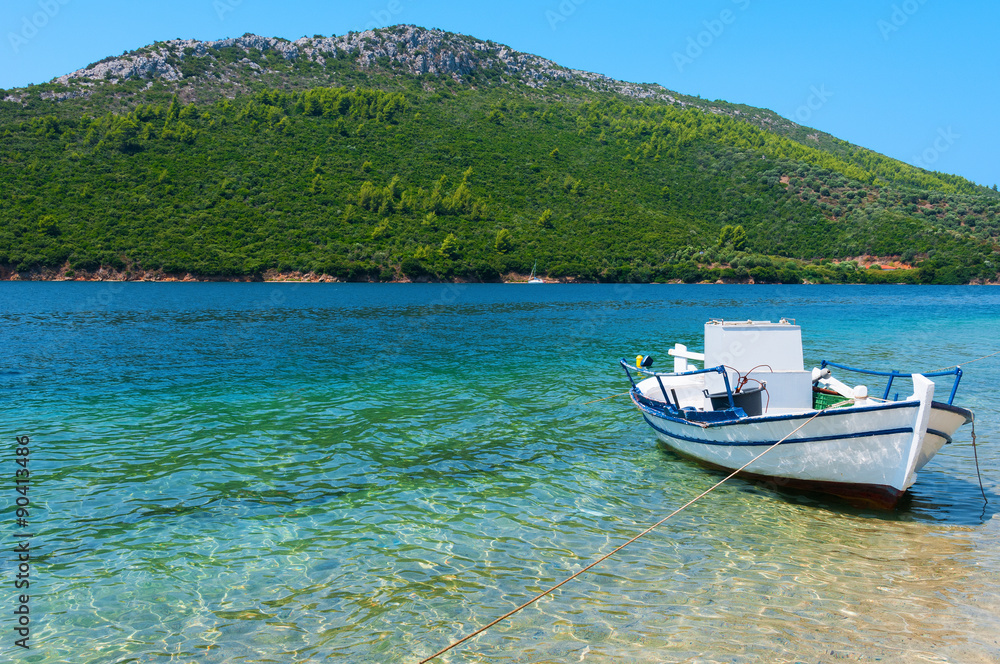 A fishing boat anchored in a small bay