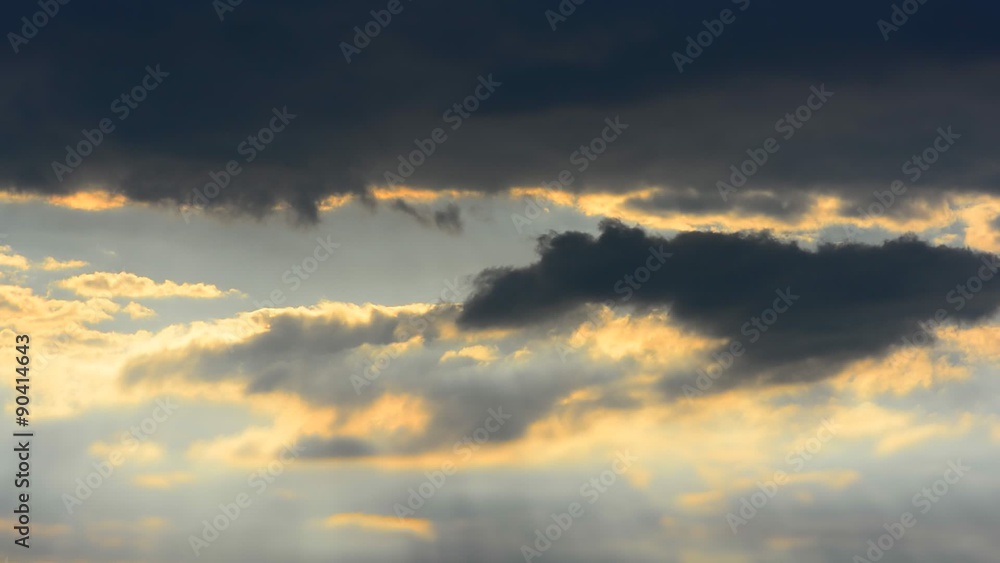 Beams of sunlight shoot through storm clouds and light the ground Beams of sunlight shoot through storm clouds and light the ground