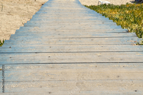 Blue wooden stairs to beach