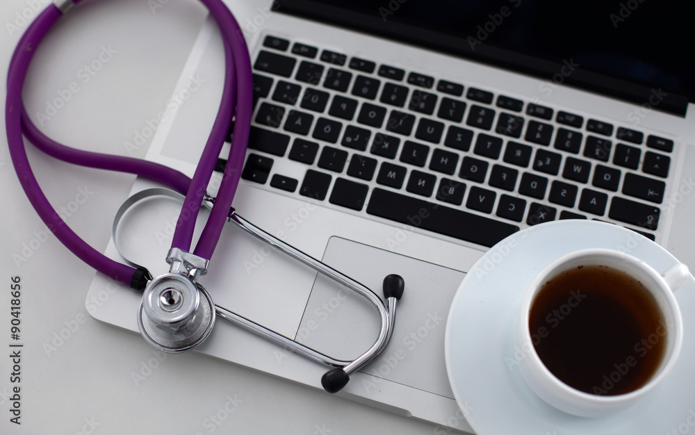 Doctor office,Top view ,Laptop with cup of coffee