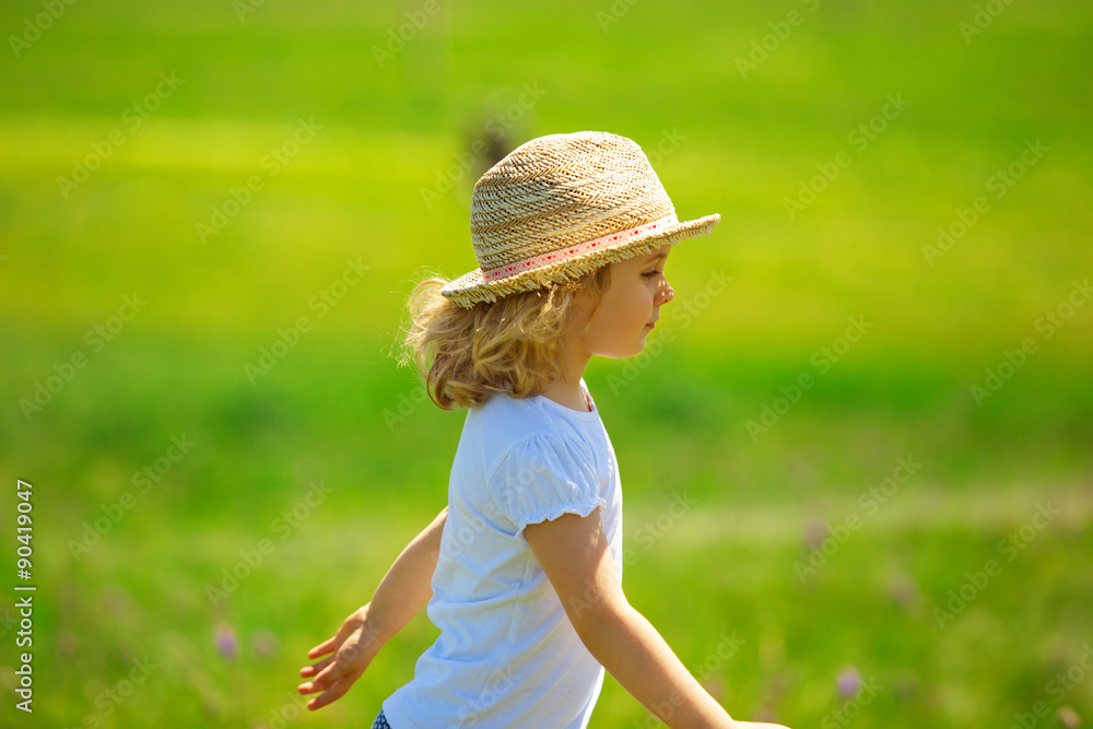 Little girl in field, summer outdoor