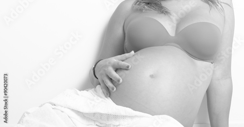 Pregnant woman in red bikini