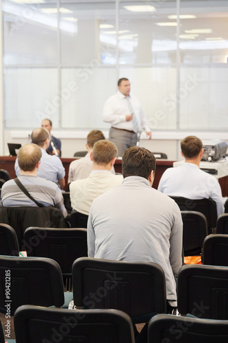 The audience listens to the acting in a conference hall