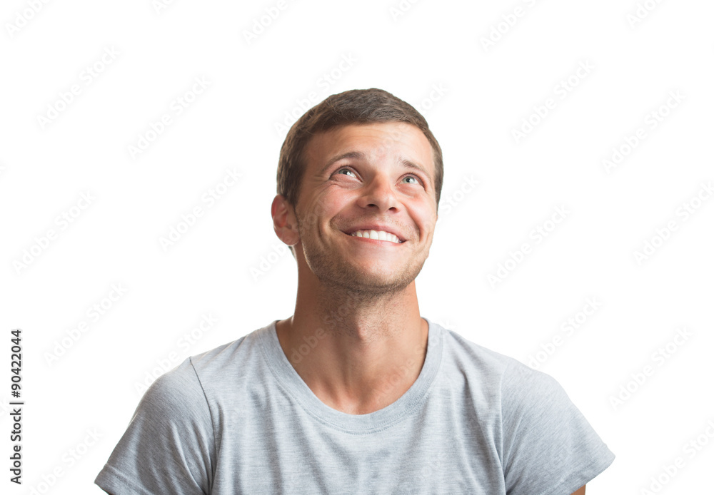 Portrait of smiling happy young man looking up - isolated on whi Portrait of smiling happy young man looking up - isolated on whi