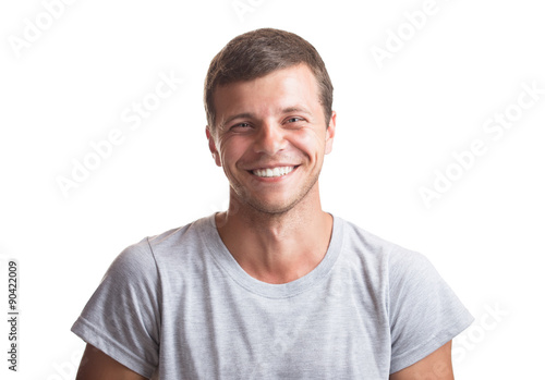 Portrait of the young happy smiling man isolated on a white back