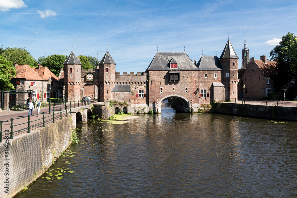 Medieval fortress city wall gate Koppelpoort and Eem River in the city of Amersfoort - tourist destination near Amsterdam, Netherlands