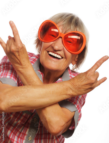 Senior woman wearing big sunglasses doing funky action  © Raisa Kanareva