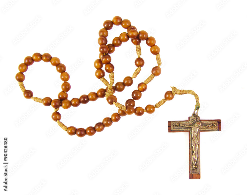 Wooden rosary beads and cross isolated on a white background Wooden rosary beads and cross isolated on a white background