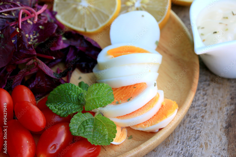 fresh red spinach salad and cream on wooden table fresh red spinach salad and cream on wooden table