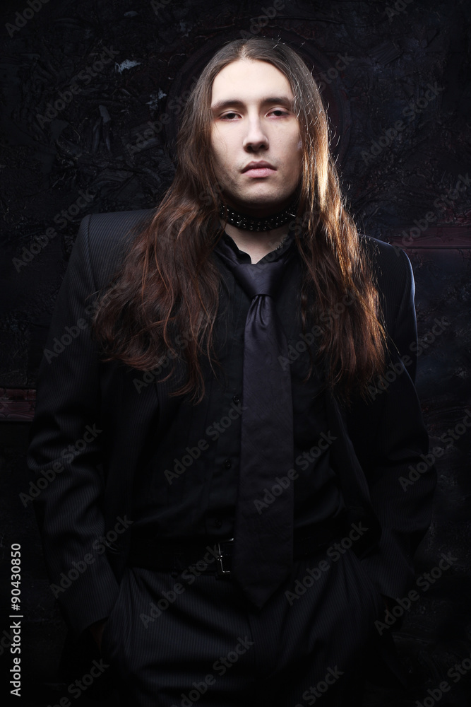 portrait of a fashionable male model with long hair portrait of a fashionable male model with long hair