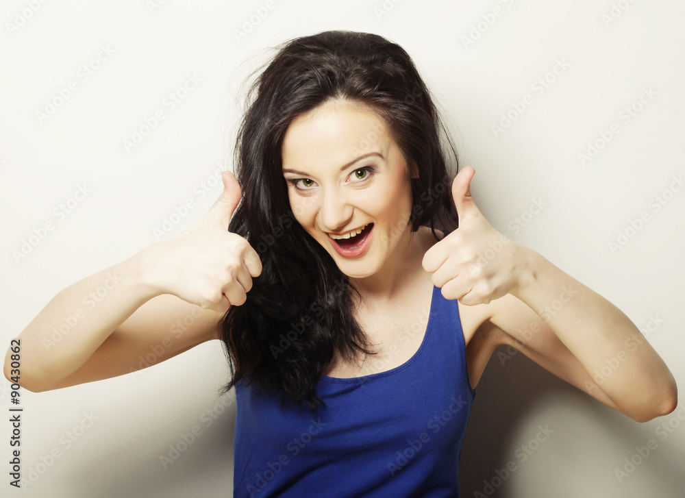 beautiful young woman showing thumbs up gesture beautiful young woman showing thumbs up gesture