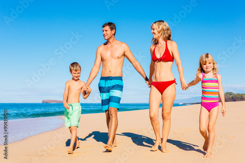 Happy Family Having Fun on the Beach