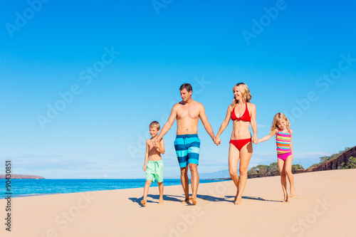 Happy Family Having Fun on the Beach © EpicStockMedia
