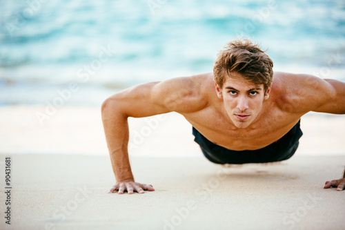 Male Athlete Exercising Doing Push-Ups