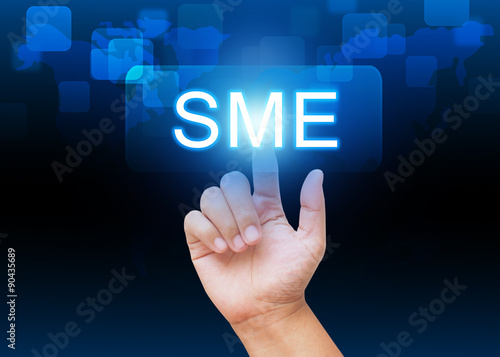 Hand pressing SME button on technology background