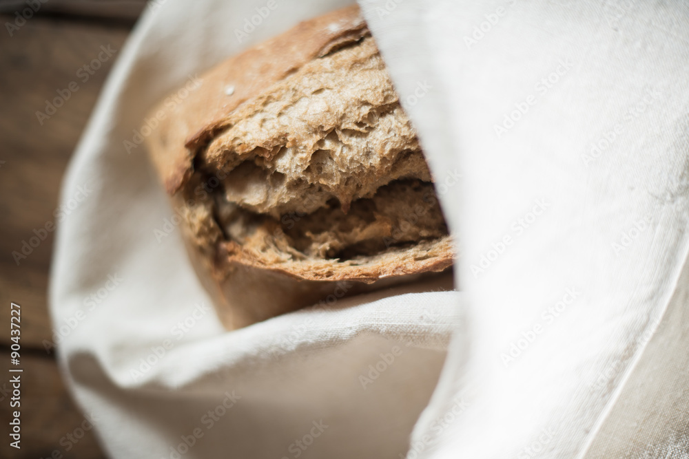 rustic bread wrapped in a linen cloth rustic bread wrapped in a linen cloth