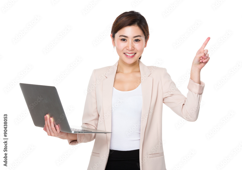 Businesswoman use of the laptop computer and finger point up