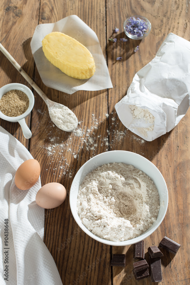 top view, ingredients to make a cake on a wooden table top view, ingredients to make a cake on a wooden table